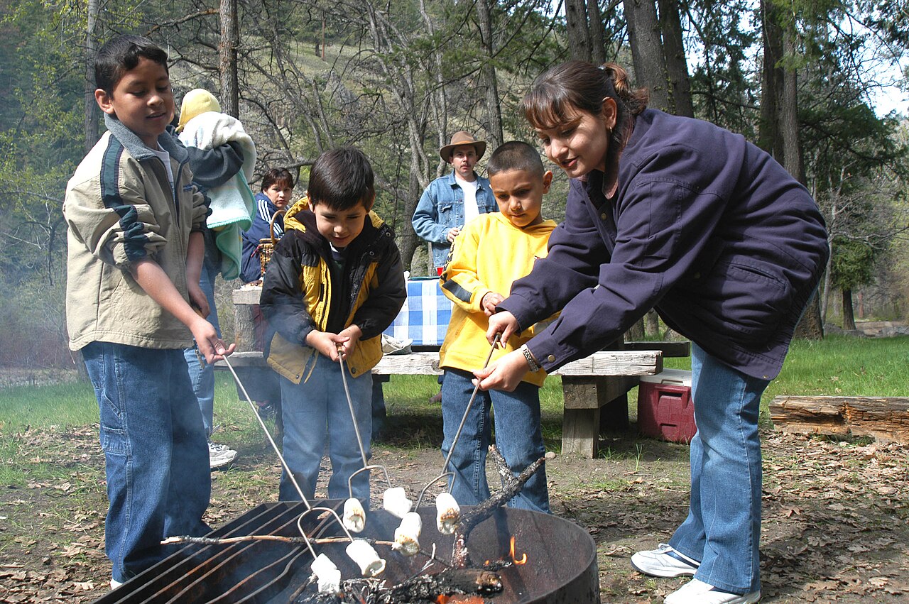 A diverse family in a welcoming outdoor community setting